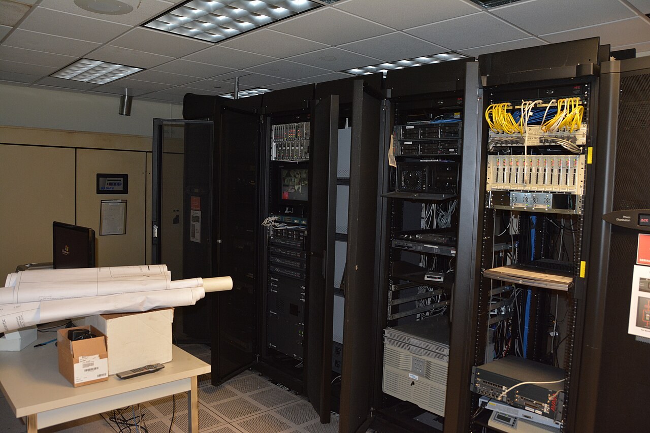 Open server racks and cabling inside a data center.